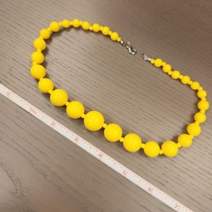 Yellow plastic beaded necklace